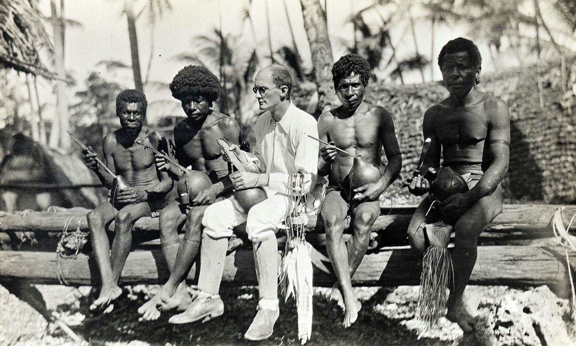 LaBiennale:Bronisław Malinowski anthropologist with the Indigenous people of the Trobriand Islands. Photographed in 1918.